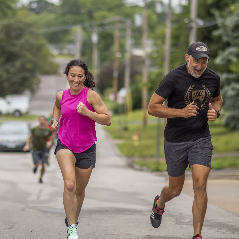 CrossFit Kirkwood Wellness Corner Blog - members running and smiling