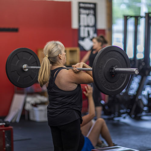 CrossFit Kirkwood member using barbell